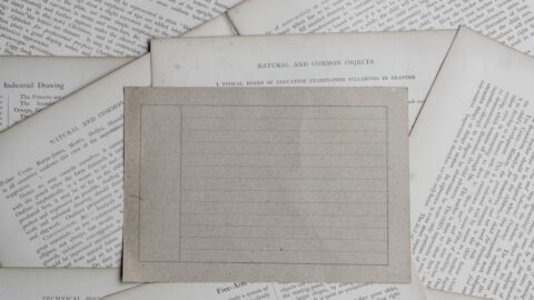 A blurred, over-optimized AI text document with a single sharp, handwritten note in the center, symbolizing human friction.
